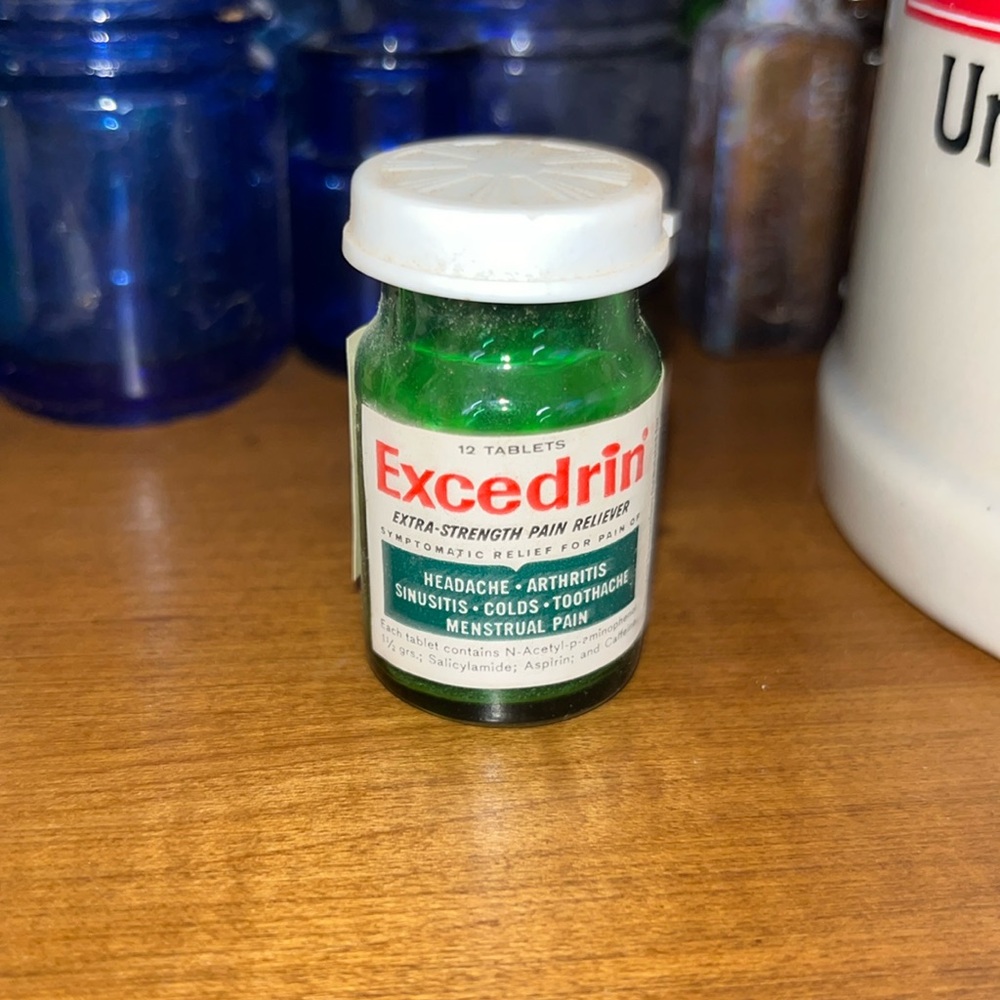Excesrin glass bottle (green) with label and plastic lid
